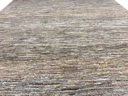 Close-up: 243x168 rug with a mottled gray-brown linear pattern and fine pile texture.