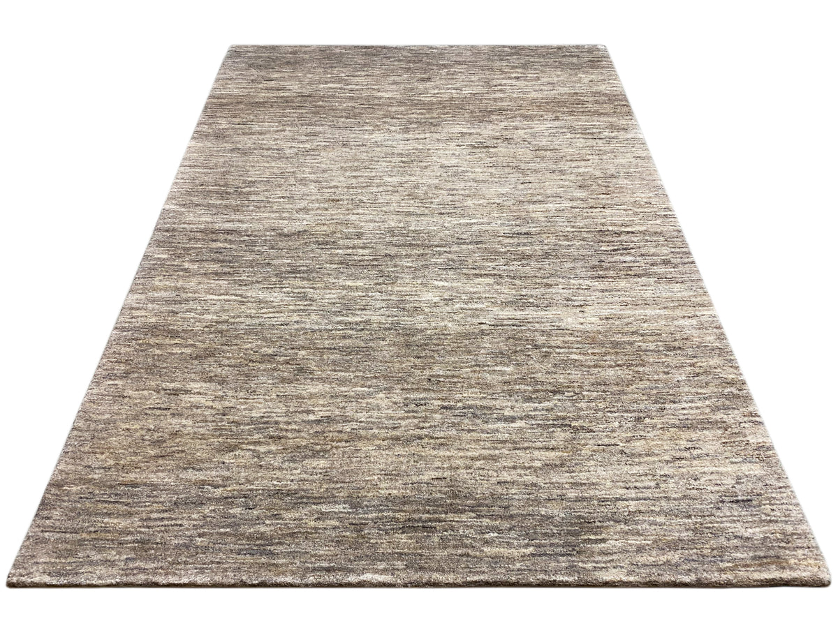 Rectangular Gabbeh rug, beige and gray mélange pattern on a smooth surface