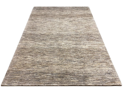 Rectangular Gabbeh rug, beige and gray mélange pattern on a smooth surface