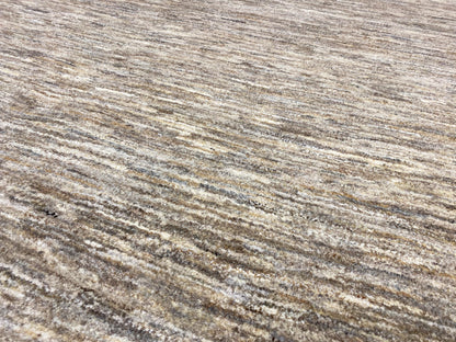 Gabbeh rug, richly detailed pile: beige-gray fibers with fine, irregular lines