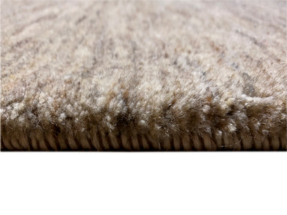 Close-up of the pile: Gabbeh rug with a dense brown-beige texture