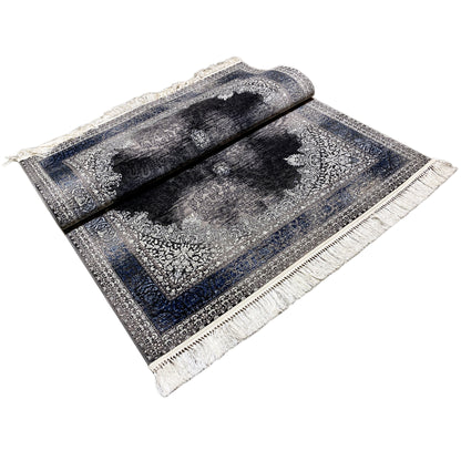 Oriental rug 160x230 folded, central motifs and border in gray, blue, and black, fringes