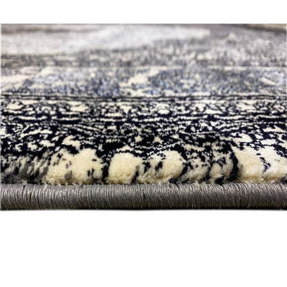 Carpet pile in detail: black-and-gray patterned, beige strands and fringes