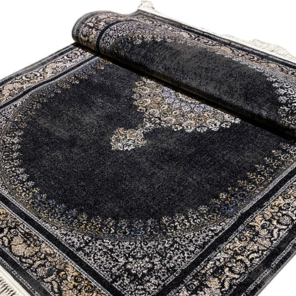 Dark gray medallion rug with an ornamental border and rolled edges