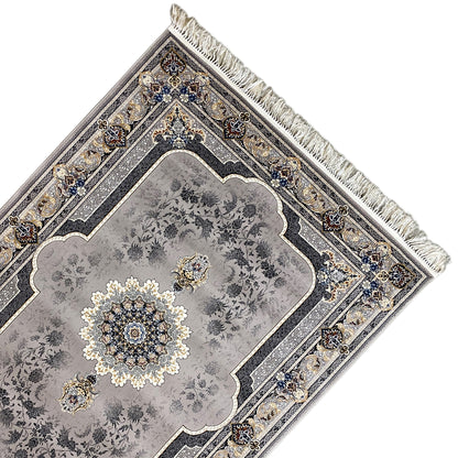 Medallion rug close-up: decorative border, gray with dark stripes, fringes