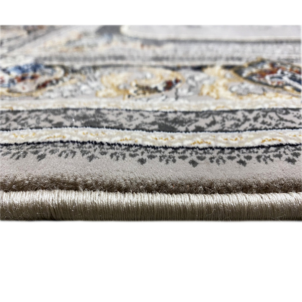 Medal carpet 160x230 close-up: short fringes and patterned pile in gray