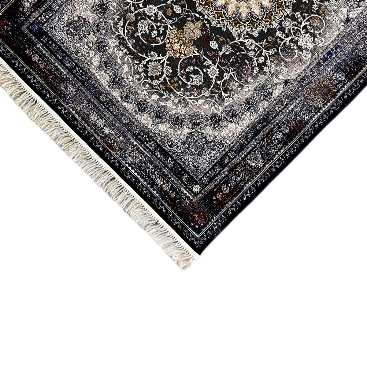 Corner view of Persian rug with detailed floral ornament in gray, black-blue, and cream fringe