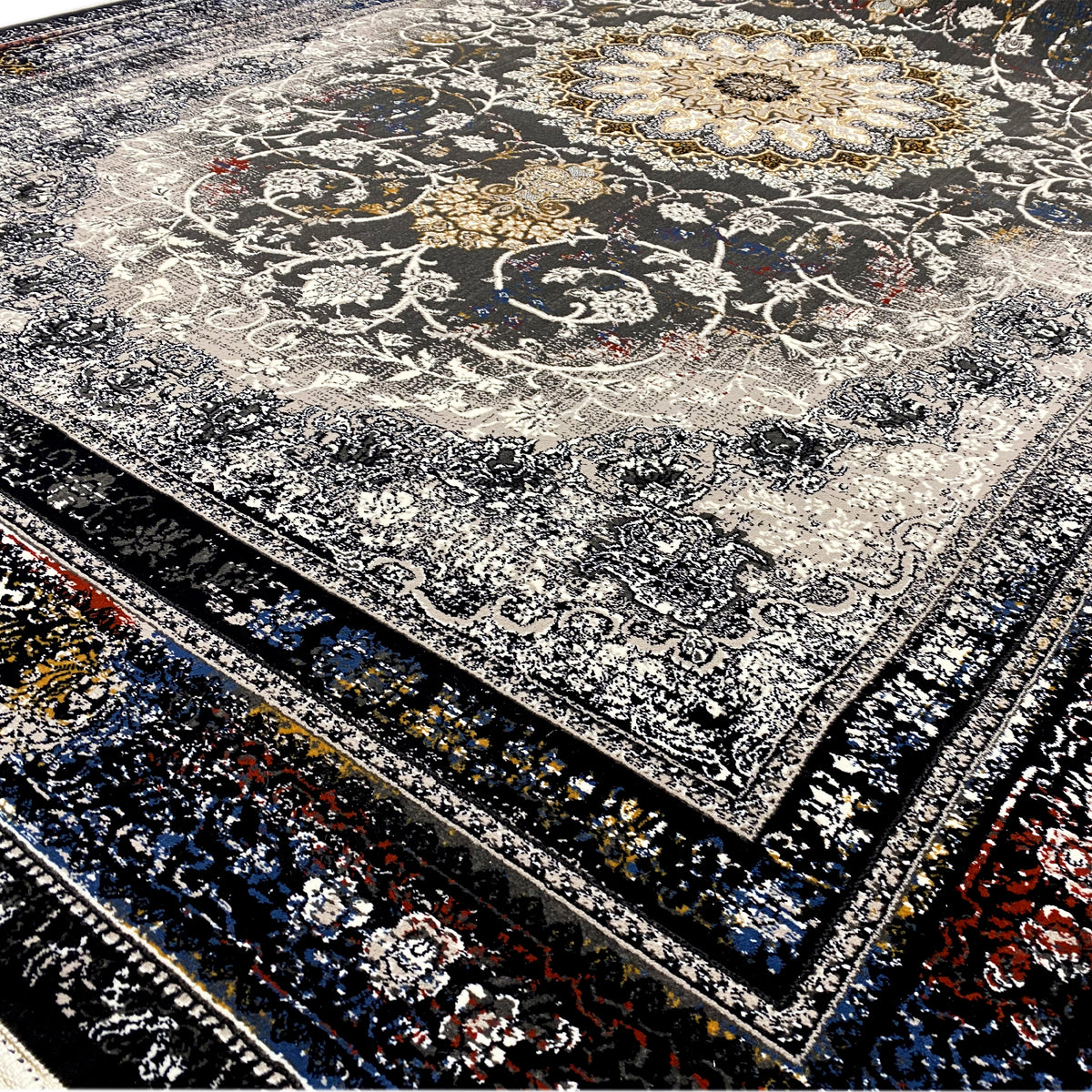 Close-up: floral ornamental band and delicate pattern on a gray-black carpet with a border