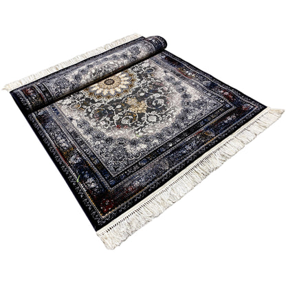 Persian rug with a round medallion pattern in gray/cream, dark blue border, and fringes