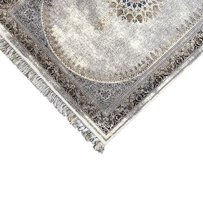 Silver-gray rug with decorative border, visible corner, and fringes along the edge