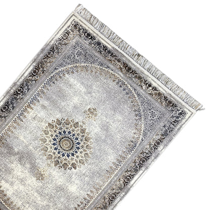 Vintage rug with a silver-gray pattern, ornamental border, and central medallion