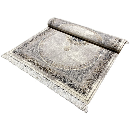 Vintage rug rolled up, silver-gray with an ornamental border and fringes