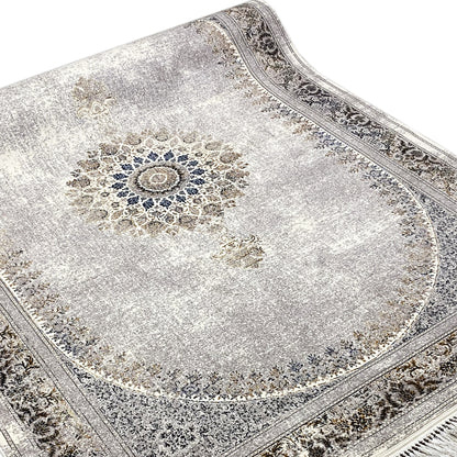 Silver-gray rug with a round ornamental medallion and embossed decorative border