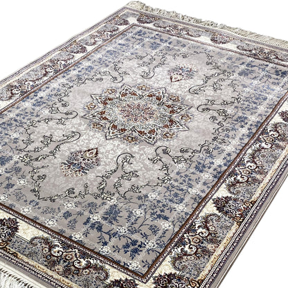 Nain rug laid flat: light blue-gray, medallion pattern, decorative border, fringe