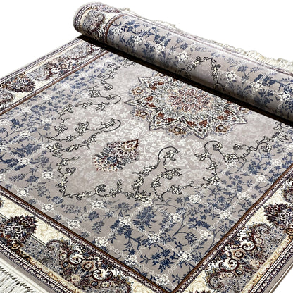Rolled Nain rug: blue ornamental design with central motifs and fringes along the edge