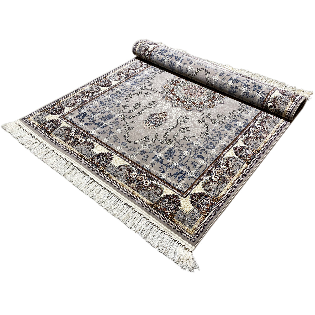 Nain rug rolled out with the rolled section at the top: blue medallion pattern, fringes along the edge
