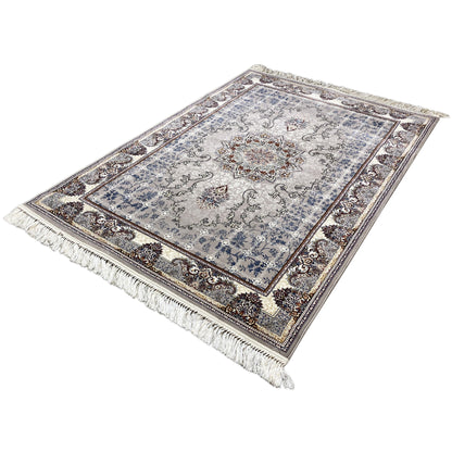Rug with a light medallion in an ornamental design, blue-gray, brown border and fringes