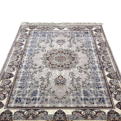 Square-looking rug with medallion, ornamental border, blue-gray, and fringes along the edge