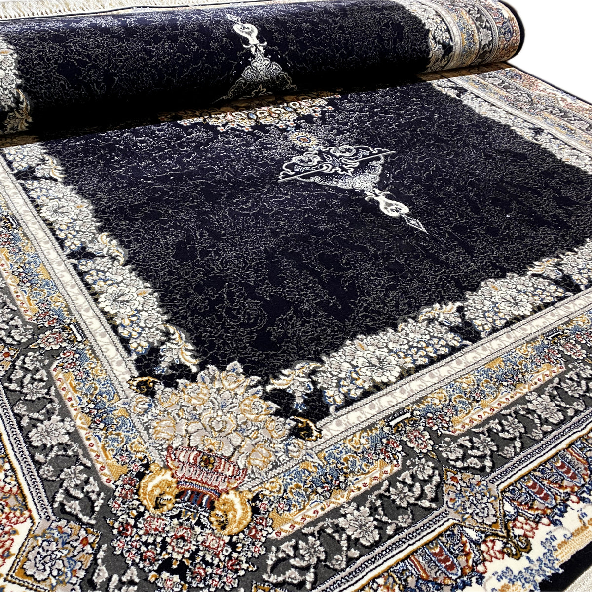 Black oriental rug with medallion, detailed border and fringe