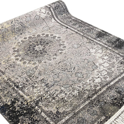 Gray mottled vintage rug with delicate ornamental details and a wide border frame