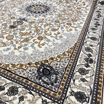 Close-up: Leyla Oriental rug with gold floral patterns and a dark blue border