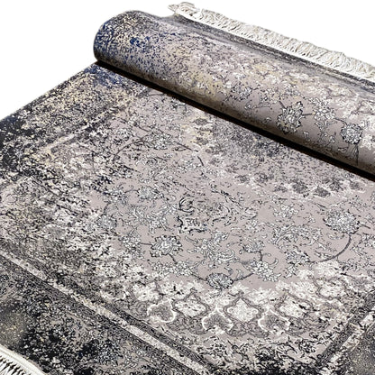 Vintage gray rug, rolled, with a delicate ornamental pattern and fringes