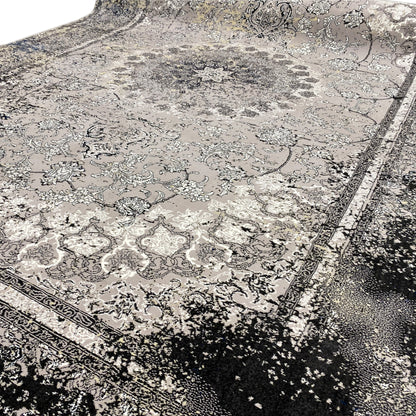 Close-up: Vintage gray rug with ornaments and a dark speckled border