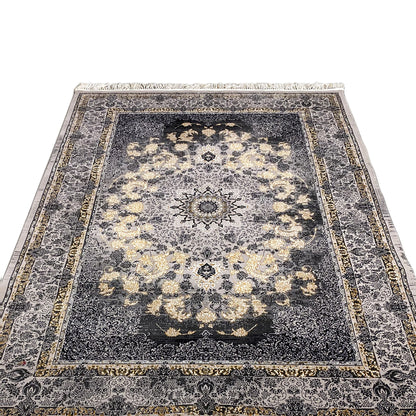 Medallion rug with a central ornamental medallion, dark blue background, beige patterns, fringes