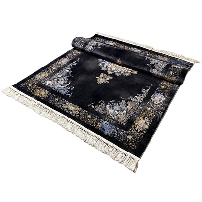 Carpet unrolled, appearing rolled up: dark background with ornaments, fringes along the edges