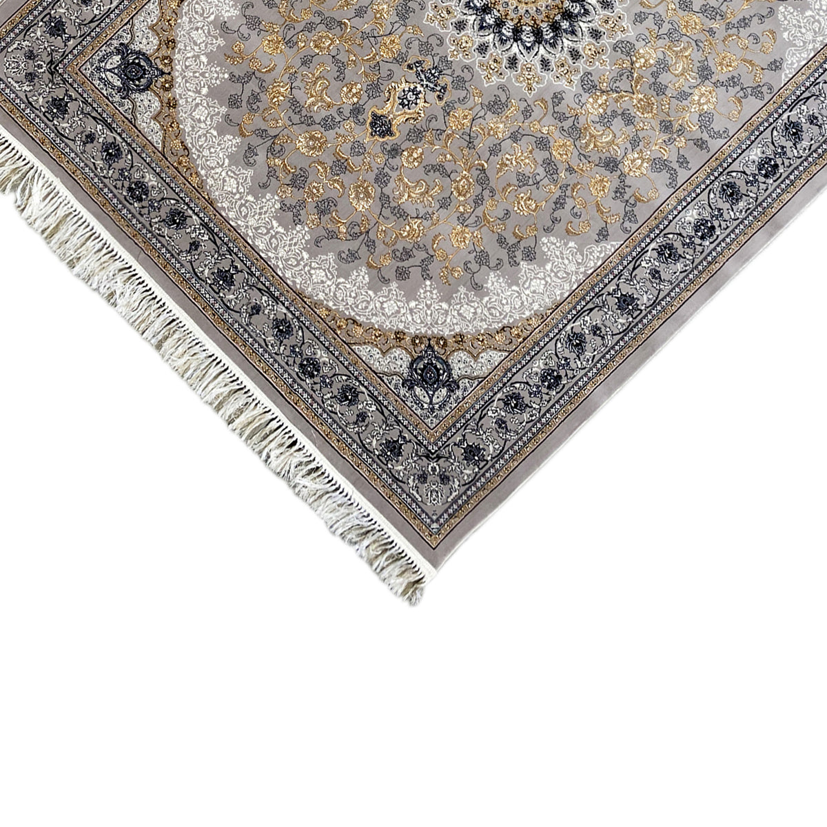 Corner detail of medallion rug: dark blue ornamental border, gray background, fringes