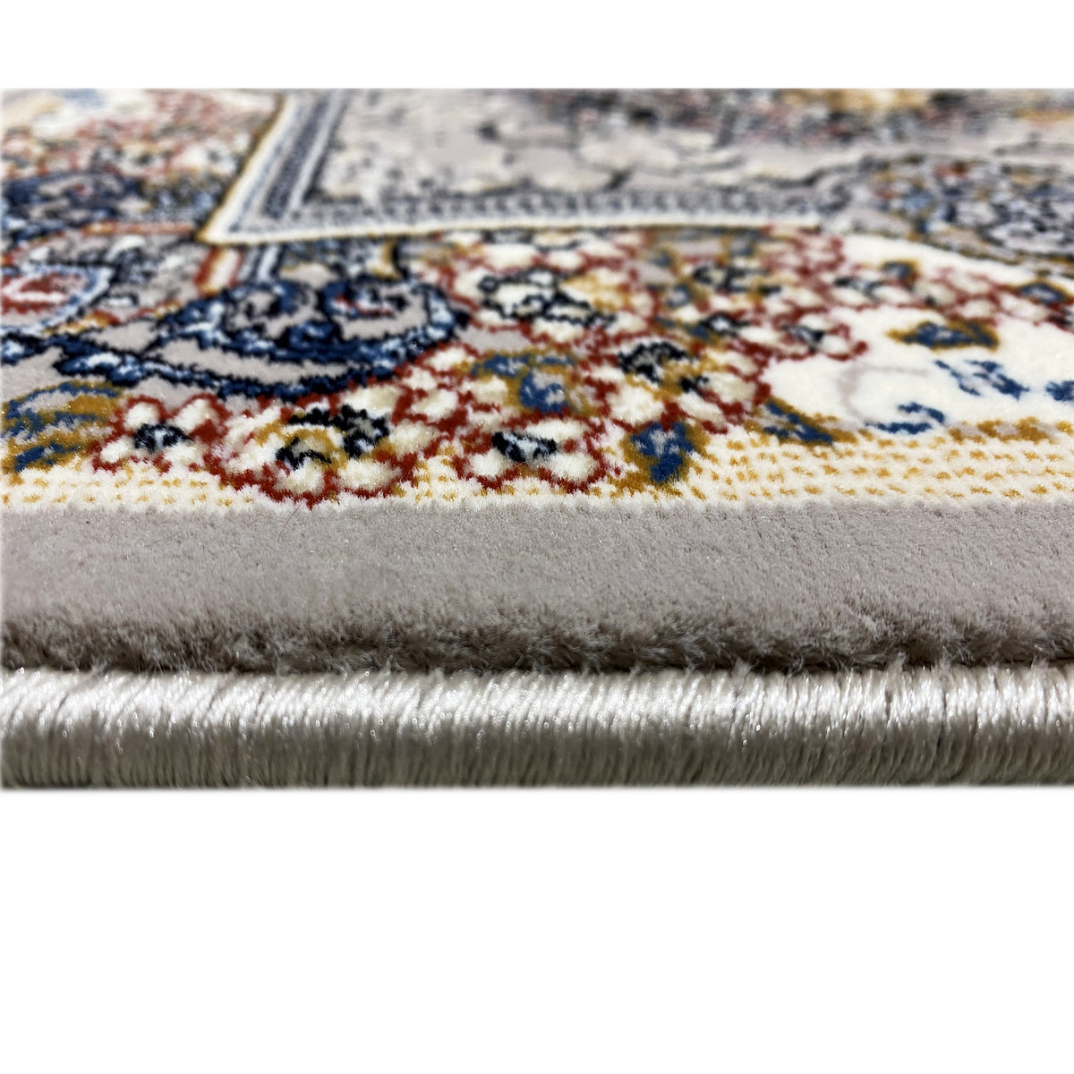 Rug Noah, detail of the fringed lower edge and colorful patterned border