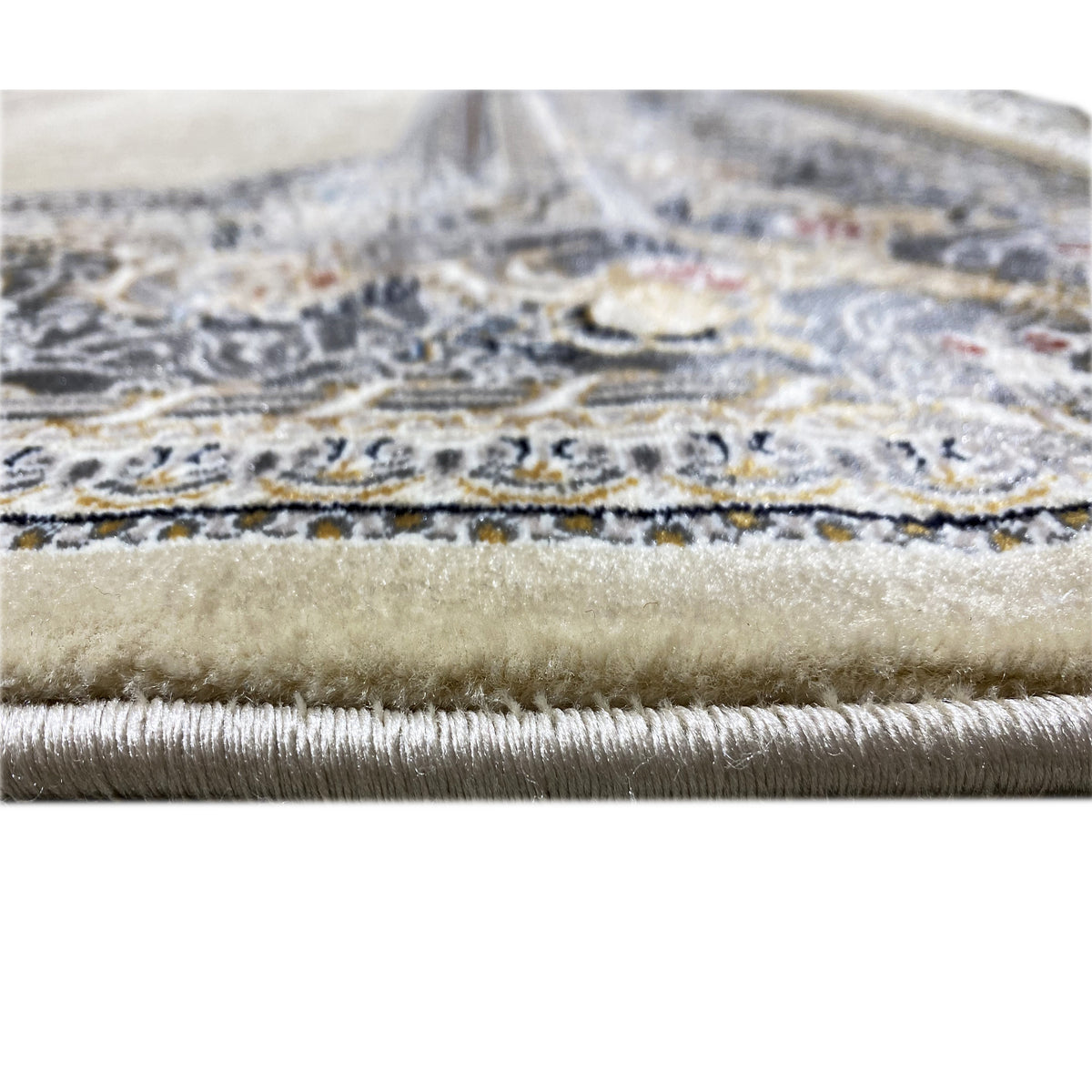 Carpet edge with fringe: blue-silver trim along the border edge