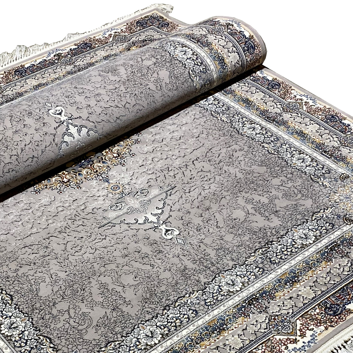 Anthracite-colored rug with medallion pattern and ornamental border, rolled