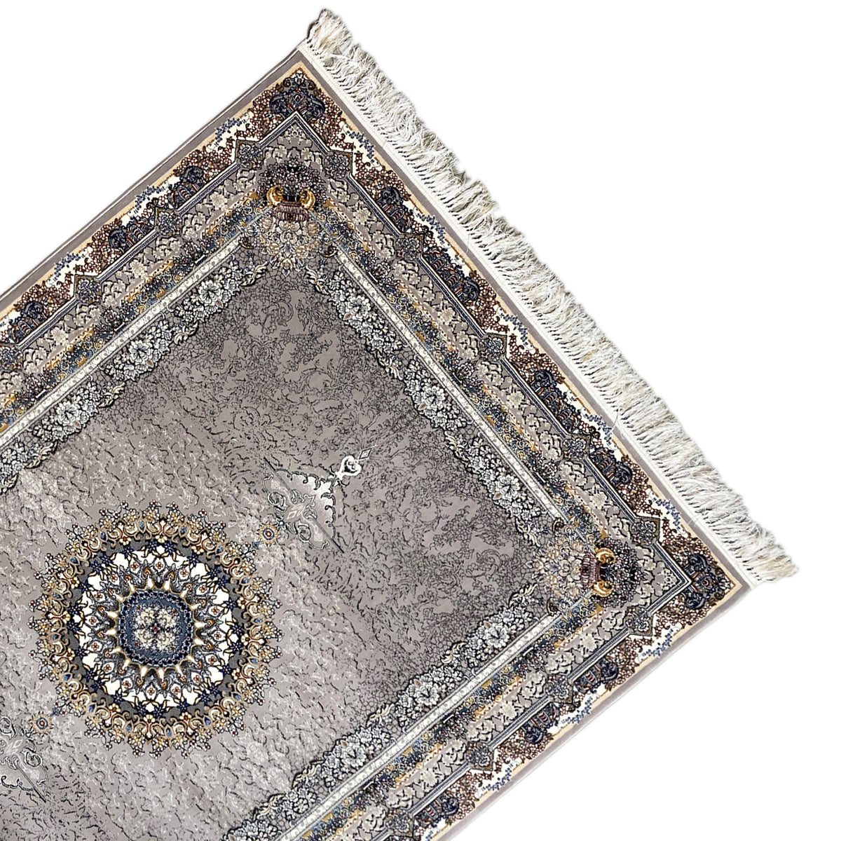 Corner view: anthracite-colored rug with ornamental border, fringe, and gold accent