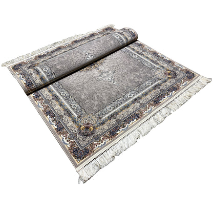 Noah rug with a border, delicate pattern, and fringes at the corners