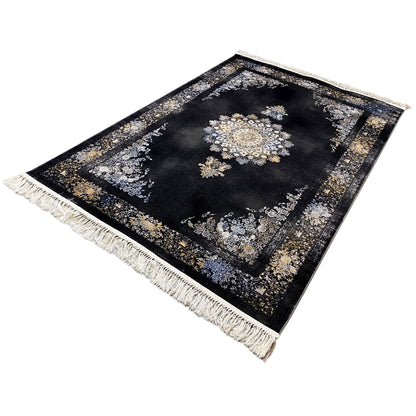 Rug shown at an angle: dark geometric-design rug with gold and silver ornaments