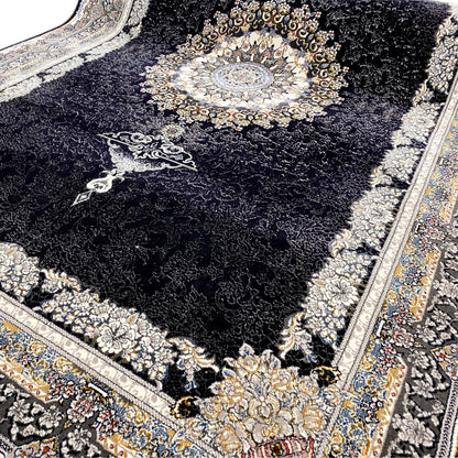 Close-up: black rug with gold ornaments, a medallion in the center, and a fringed edge