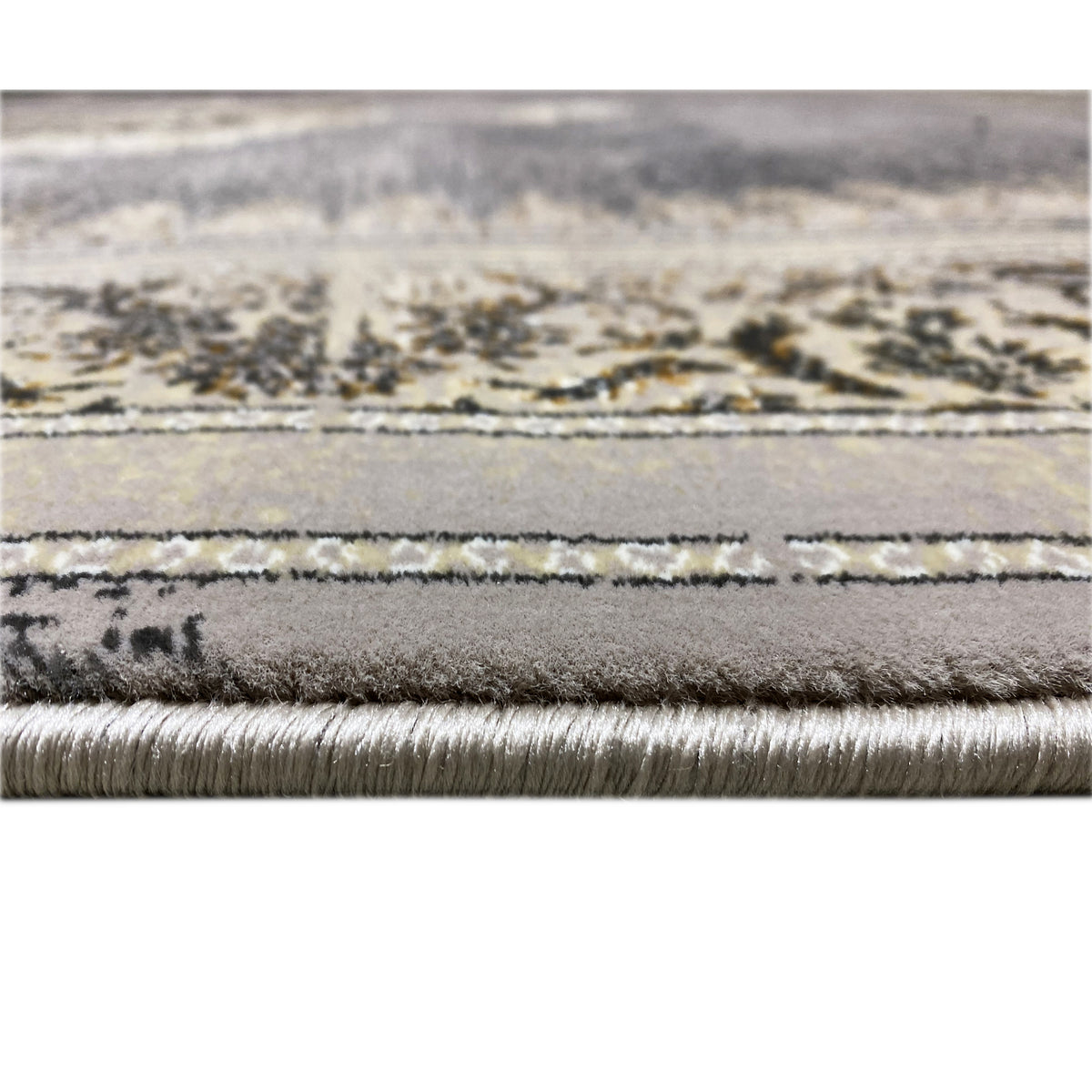 Rug edge with fringes and patterned stripes, mottled gray, gold-beige details