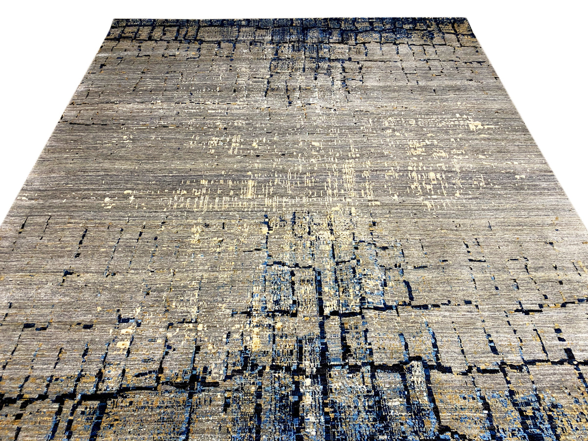 Hand-knotted rug in light gray with a dense abstract blue pattern