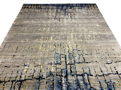 Hand-knotted rug in light gray with a dense abstract blue pattern
