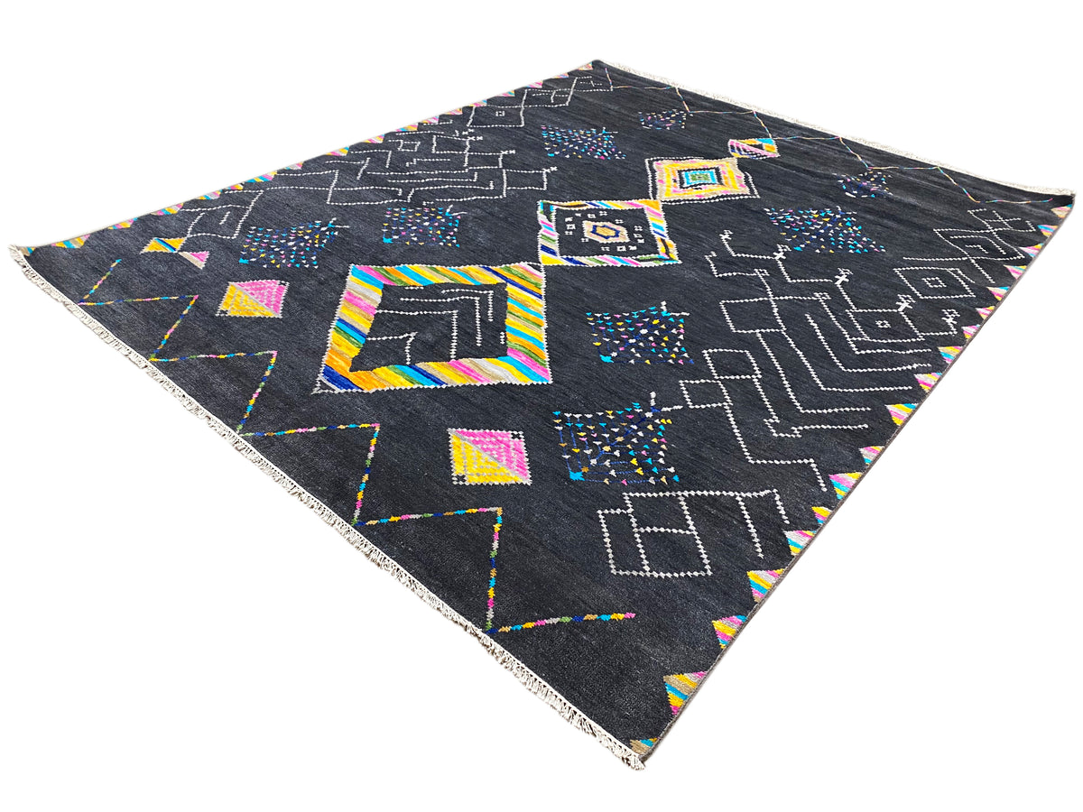 Black designer rug with colorful geometric patterns, triangular view of the surface