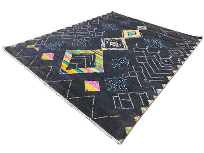 Black designer rug with colorful geometric patterns, triangular view of the surface