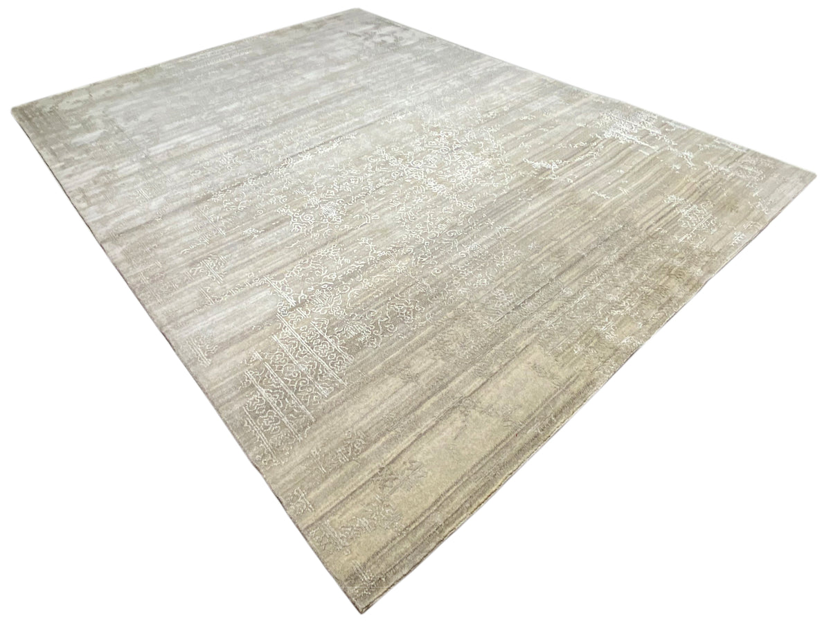 Triangularly folded beige rug with a fine, blurred texture and lines