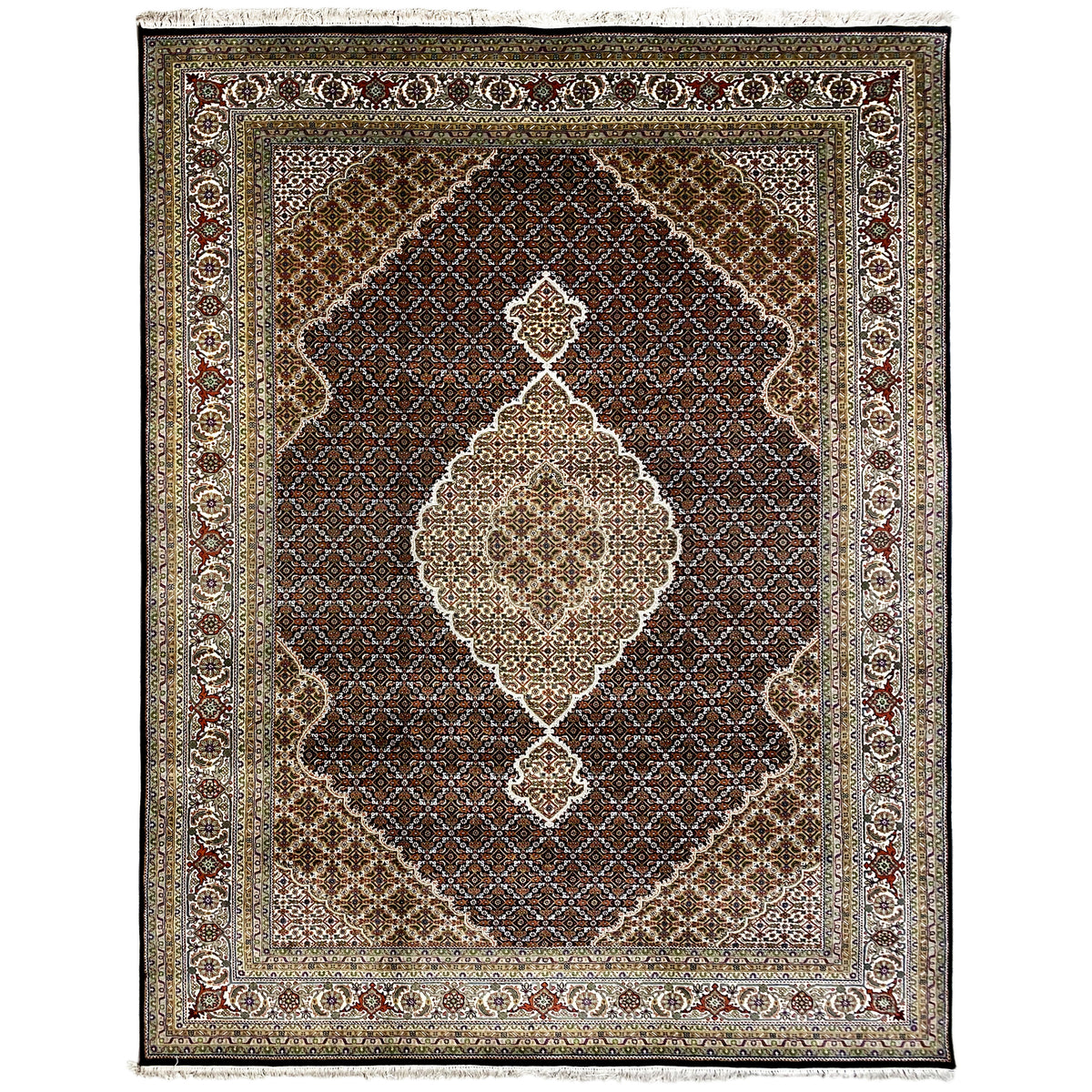 Brown Indo-Tabriz rug with a large central medallion, border, and fringes.
