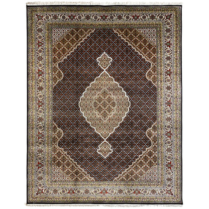 Brown Indo-Tabriz rug with a large central medallion, border, and fringes.