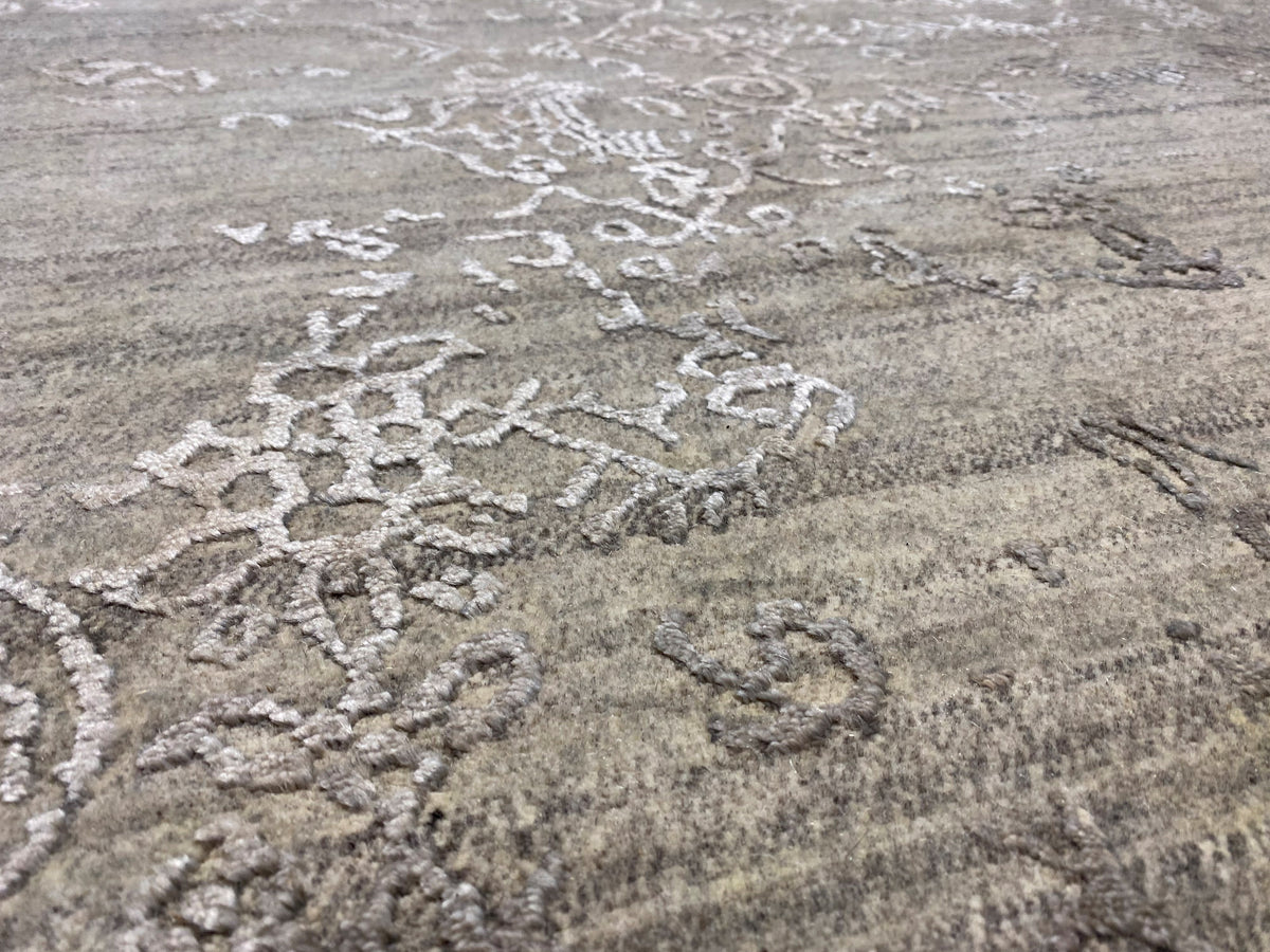 Gray designer rug with a floral ornamental pattern and relief-like texture