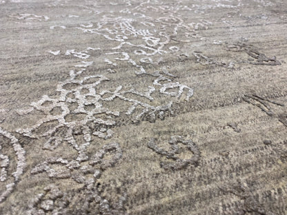 Gray designer rug with a floral ornamental pattern and relief-like texture
