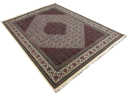 Bidjar rug: flat overall design with a central medallion, dark red and beige