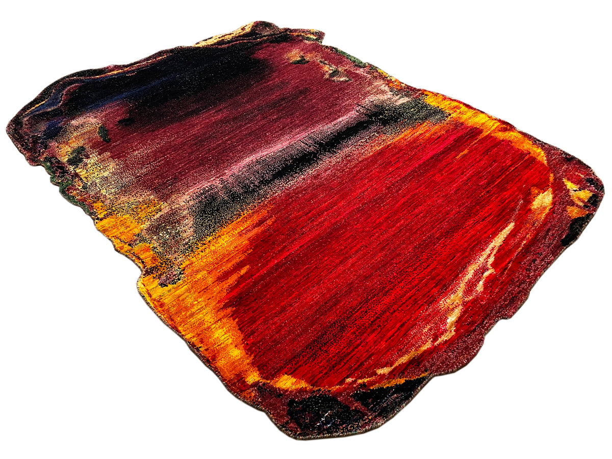 Abstract designer rug, rectangular, red-orange-yellow with dark accents, colored edges