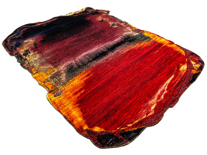 Abstract designer rug, rectangular, red-orange-yellow with dark accents, colored edges